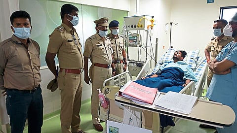 Police with saved patient