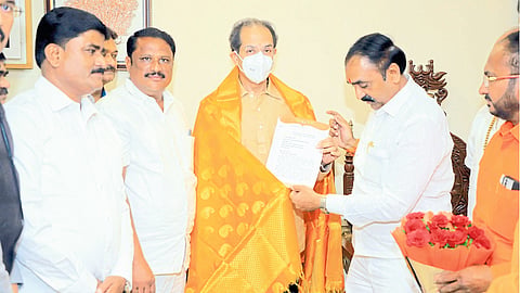 Matoshreet Shiv Sena chief Uddhav Thackeray giving a letter about the organization, former mayor Bhagwan Karankal.