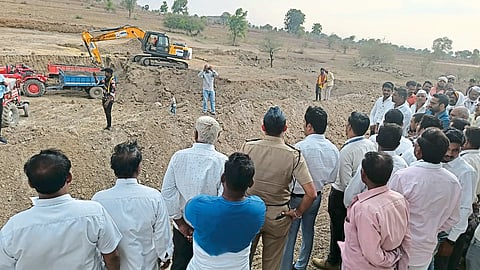 Collector Abhijit Raut and villagers inspecting the ongoing works by JCB for Amrit Sarovar.