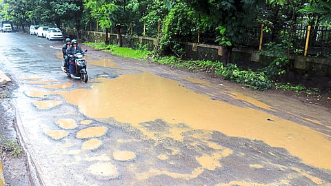 Potholes on service road latest rain news