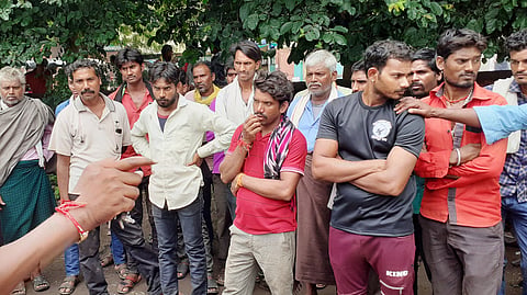 Police while explaining the angry relatives of the dead woman at Upazila Hospital on Friday.