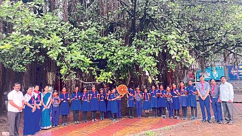 Scout guide students and teachers of Sukhdev Vidyamandir tying rakhi to a 250-year-old banyan tree
