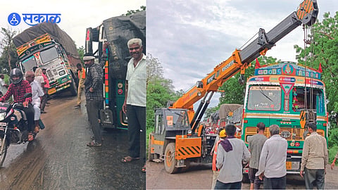 The overturned truck near the petrol pump and the truck stuck in the site