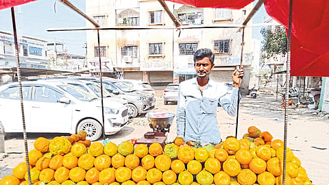 Nazim Sheikh selling oranges in Satana Naka area.