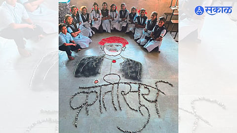 An image of Mahatma Phule carved out of colorful stones by the students of Ujjwal School here.