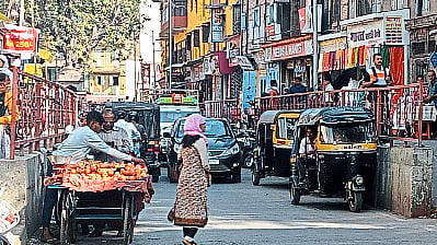 Smart narrow road taken over by rickshaw pullers and hawkers