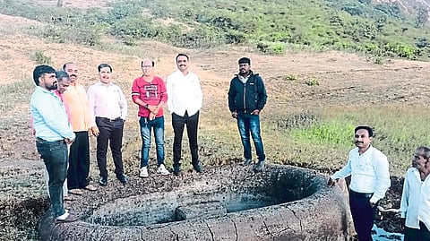 Local villagers and officials inspecting the cisterns found during the cistern search at wani gad