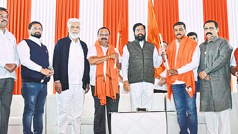 Bhausaheb Chaudhary, Sunil Patil during Balasaheb's entry into Shiv Sena in the presence of Chief Minister Eknath Shinde. Guardian Minister Dada Bhuse, MLA Suhas Kande are neighbors.