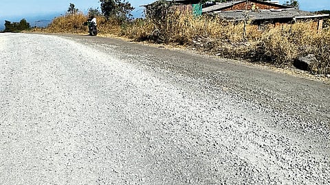 Two-wheeler riders making difficult journey due to dry concrete, gravel dumped on Dhamangaon road near Adsare Khurd.