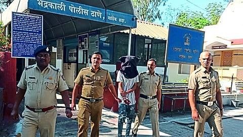 Officer-employees of Bhadrakali police station while producing the suspect in the court.