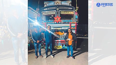 Assistant Superintendent of Police Abhaysingh Deshmukh and police personnel with the seized rice truck.