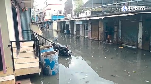Sewerage entering the commercial areas of Bapu Gandhi Nagar.