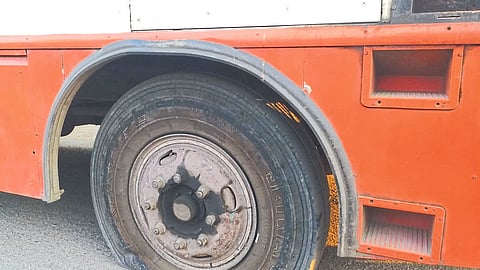 Punctured front wheel of bus