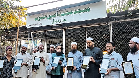 MLA Maulana Mufti Ismail starting the installation of 183 LED lights in Theil Bada cemetery area on Sunday. Officials of Neighbors Cemetery Trust.