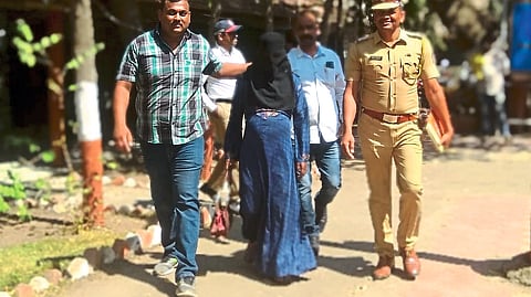 Police arresting Burkhadhari Manohar