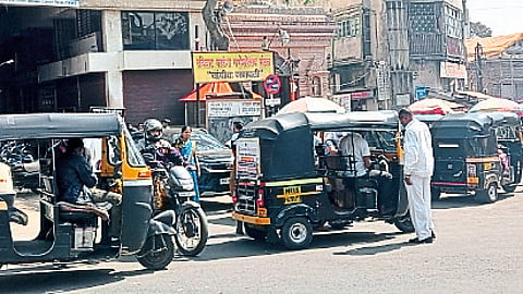 Silver rickshaws lined up on the road in front of Ganpati temple by rickshaw pullers.