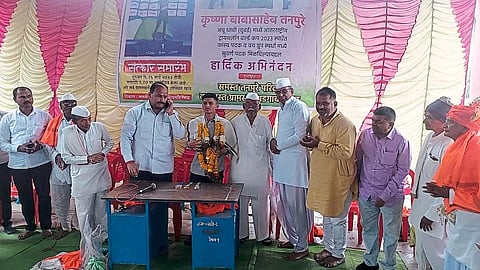 Former MLA Marotrao Pawar felicitating Krishna Tanpure, who won a gold medal in triathlon