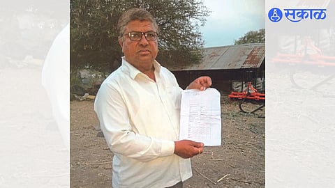 Ramesh Bachhaw showing a copy of the application form declared dead on the portal of PM Kisan Yojana.