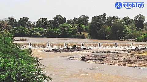 Kolhapur type dam overflowing near Vyaghreshwar temple after releasing its last circulation into the Mosam riverbed for drinking water from the dam at Haranbari (T.Baglan).