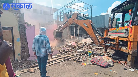 The municipal team while moving the JCB on the remaining encroachments in the Khadipatti area on Wednesday.
