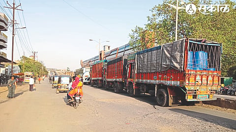 Trucks parked on the busiest Mumbai-Agra highway due to lack of truck terminus in Malegaon city.