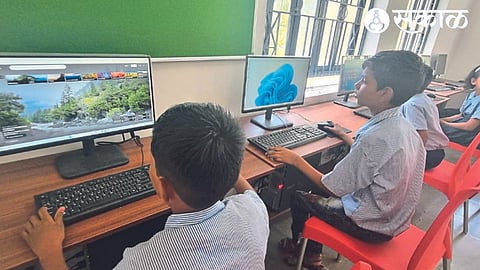Students handling the computer on the first day