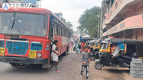 Vehicles parked on the road in front of the Khadi village industry.