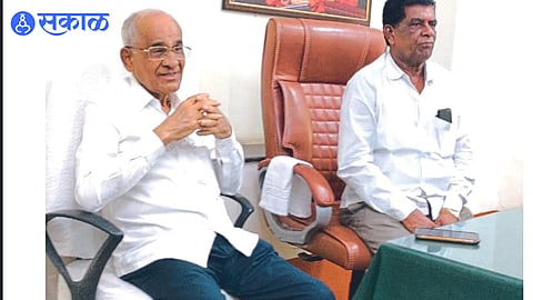 Dhule: Bajirao Patil giving information about the affairs. Ex-minister Rohidas Patil next door.