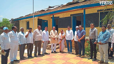 Zilla Parishad delegation present during the inspection of rain-damaged school.