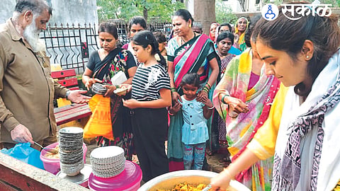 While donating free food to the patients' relatives and visitors in the district government hospital premises.