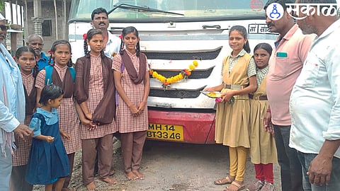 Villagers welcoming the first bus for students after independence.