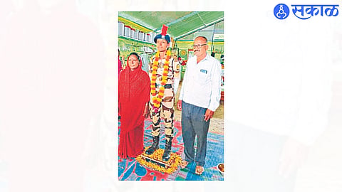 Kamini with parents.