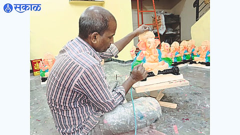 Sculptor busy with making Ganesha idol