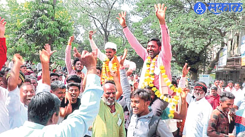 Winning candidates cheering after being elected.
