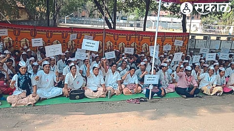 Employees of 'NRHM' protesting near Cumaine Club for various demands.