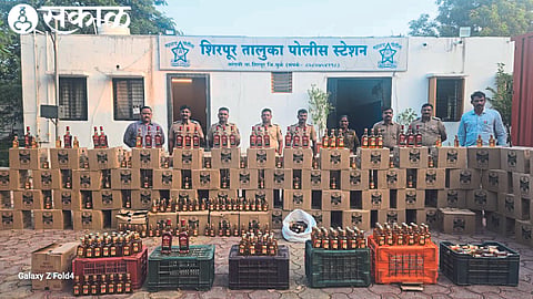 Deputy Superintendent of Police Sachin Hire, Assistant Inspector Suresh Shirasat and officials while inspecting the seized liquor stock.