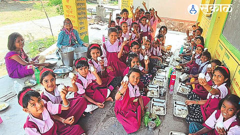 Banganganagar (Niphad): Students eating eggs at mid-day meal at Zilla Parishad Primary School