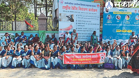 Asha group promoters protesting in front of the collector's office.