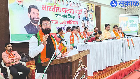 State General Minister Vijay Chaudhary office bearer on platform while speaking at BJP meeting