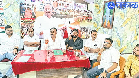 NCP's Dhule City-District President Kailas Chaudhary while giving information about Deputy Chief Minister Ajit Pawar's programs in Dhule.
