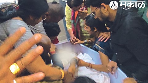 Family members visiting the body of hero Hemant Devre in Nagremala on Tuesday.