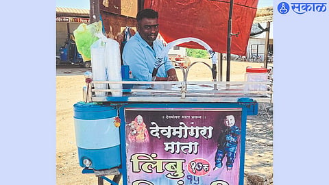 Businessman standing by road with a handcart of lemon juice