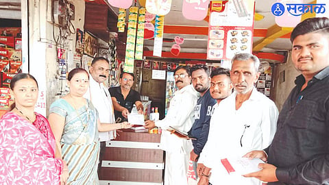 Team leader Subhash Thorat, Yamini Jate, Kishore Chaudhary and municipal employees while giving tax receipts to businessmen.