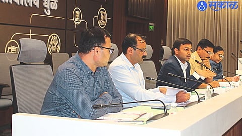 Abhinav Goyal speaking at the meeting of department heads at the collector's office.