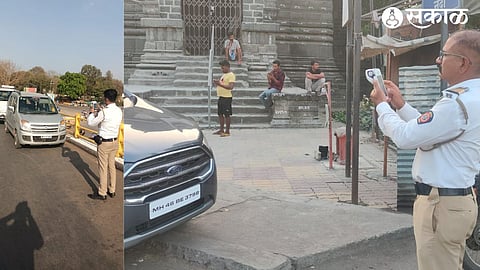Police officials of the traffic branch levying fines through e-challan on vehicles parked in no-parking areas in the city.