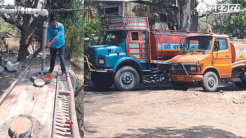 Workers filling tankers with water. Tanker standing to fill water.