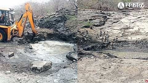 Deepening of submerged spring by JCB machine in old village forest area. A herd of monkeys came to a spring to drink water.