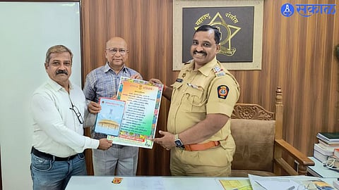 while giving a pamphlet of enlightenment against fraud. Dr. Thaksen Gorane, Mahendra Datrange