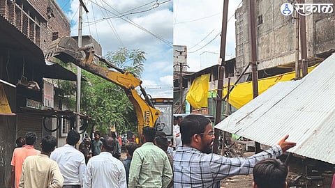 Employees removing encroachments with the help of JCB in ward number two of Malegaon