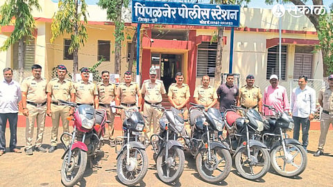 Assistant Police Inspector Sachin Kapadnis and staff with seized bikes.